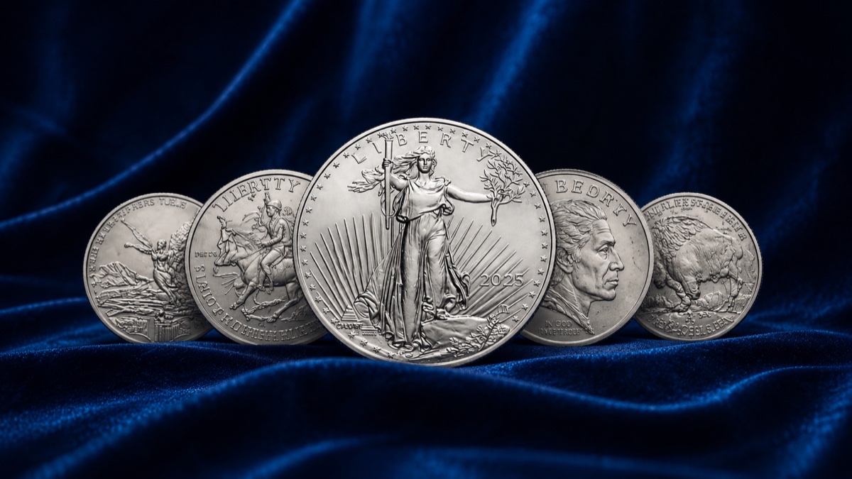 Silver American Eagle and sovereign silver coins on blue velvet